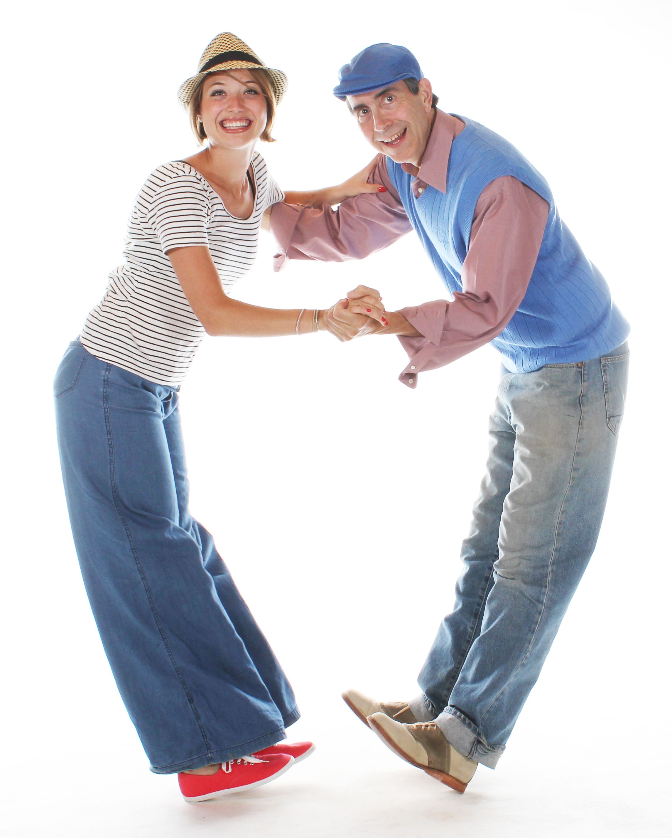 Swing — happy couple swing dancing indoors. Stock photo.