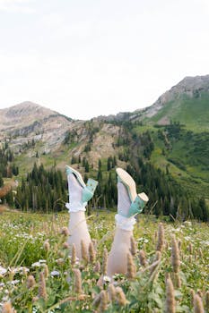 Stylish heels amidst a lush mountain field in Alta, Utah.