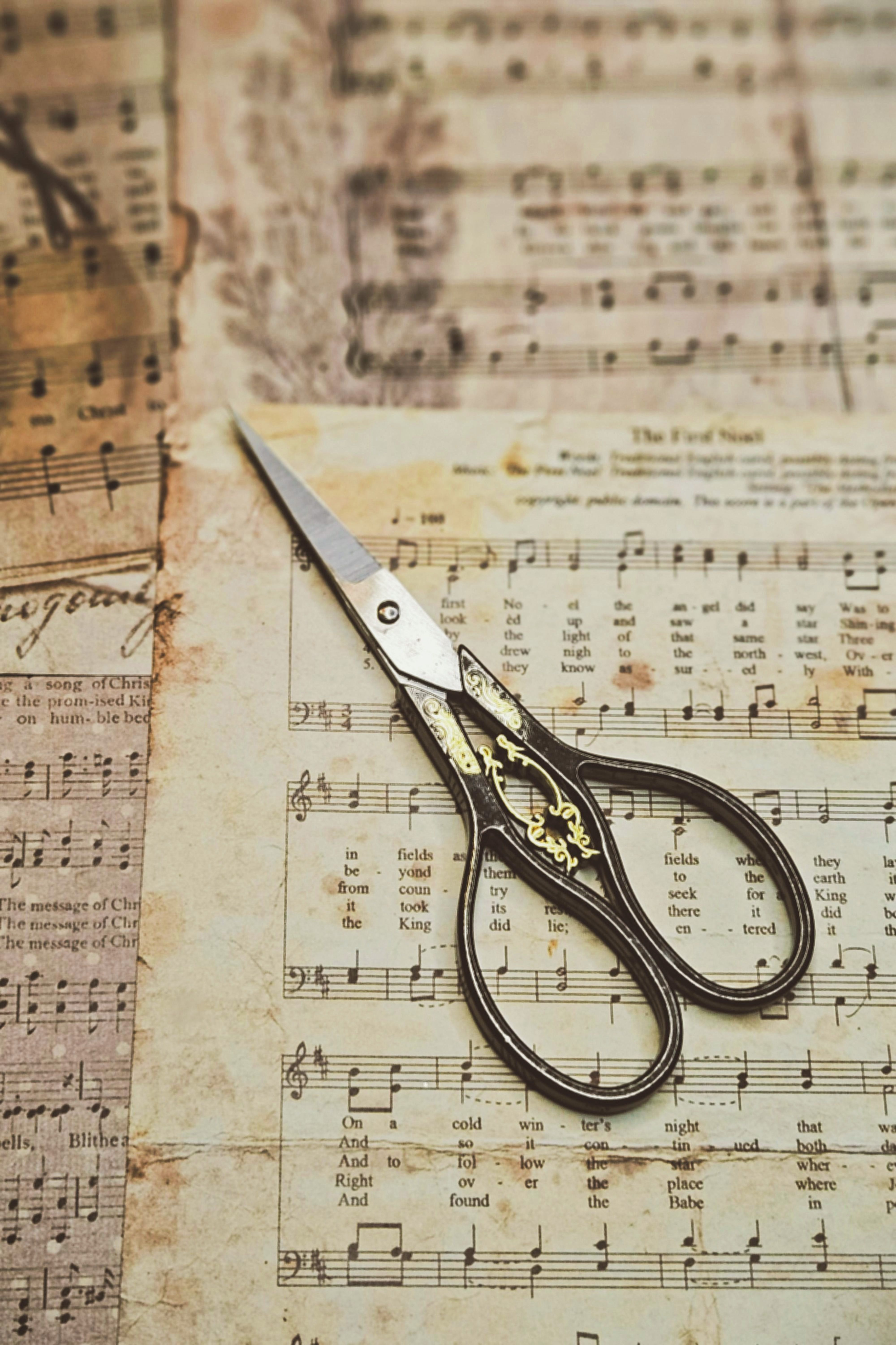 Vintage Scissors on Antique Sheet Music · Free Stock Photo
