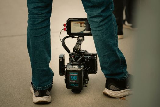 Close-up of a modern professional camera rig setup in outdoor filming.