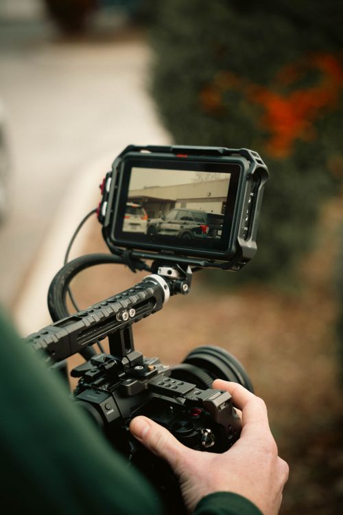 Cinematic Camera Display Capturing Outdoor Scene · Free Stock Photo