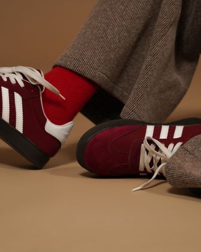 Burgundy sneakers — photo by sara kazemi on Pexels