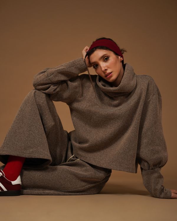 Woman in an oversized turtleneck with wide-leg lounge pants