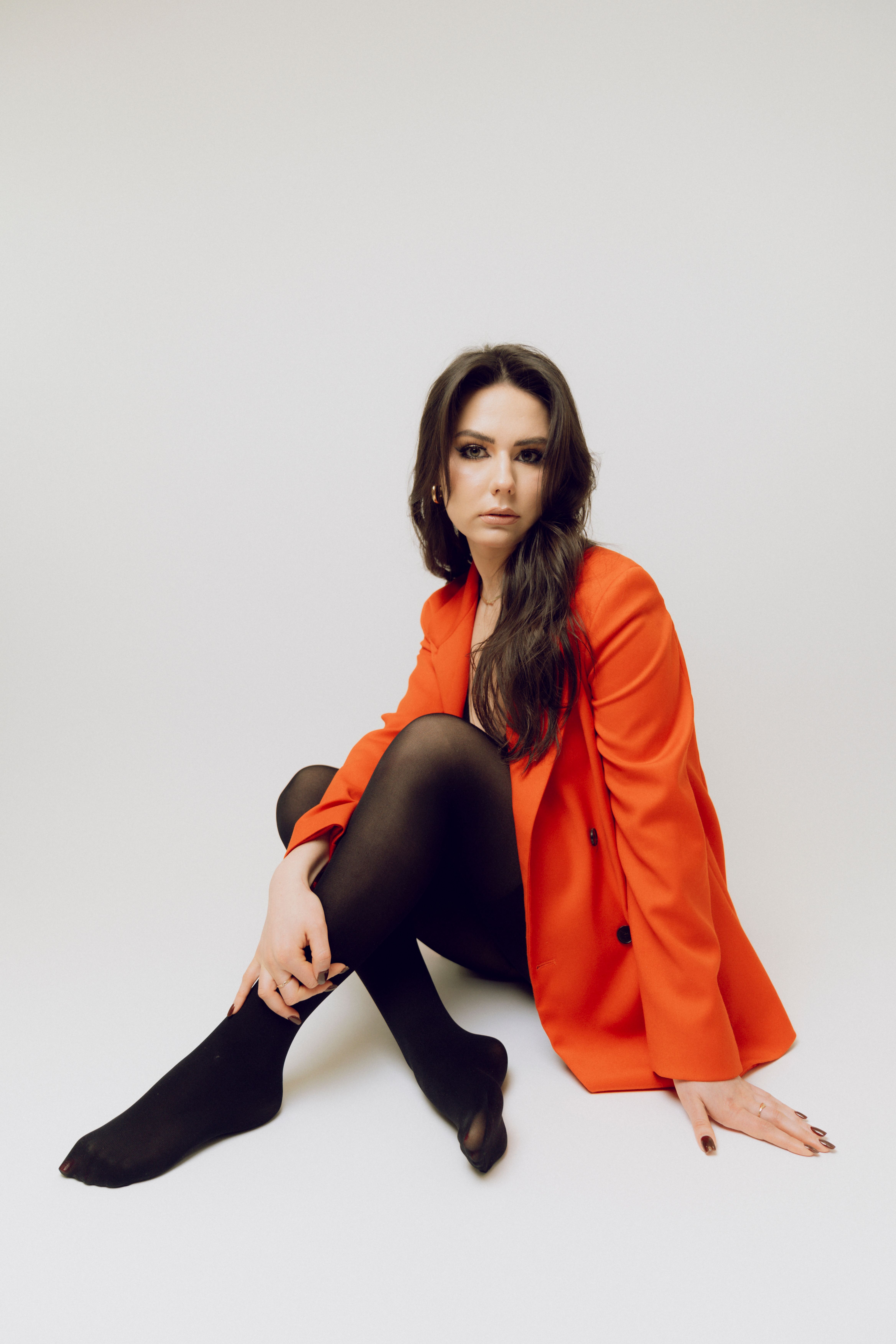 Portrait of a Model in Vibrant Red Jacket · Free Stock Photo