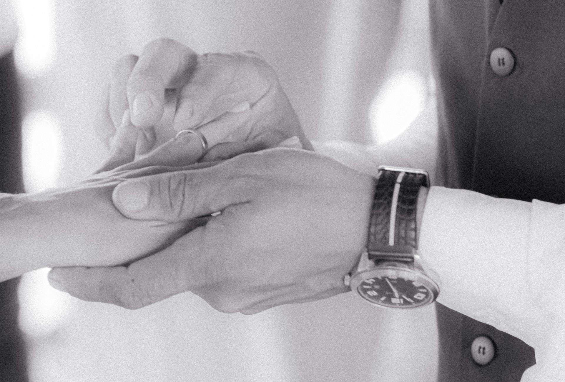 A close-up view of a couple exchanging rings, capturing the elegance of a wedding ceremony.