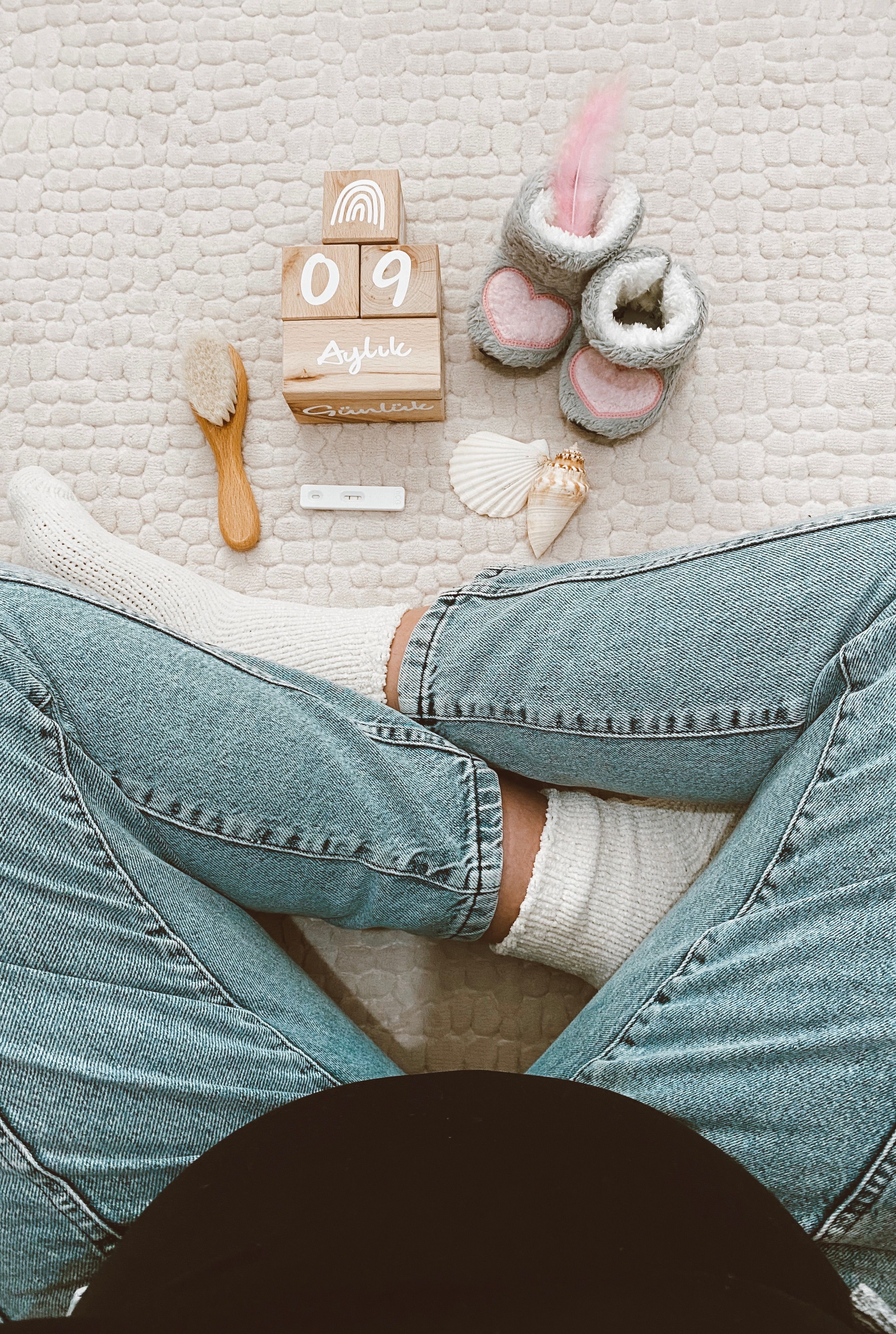 Pregnancy essentials arranged neatly in a soft flat lay