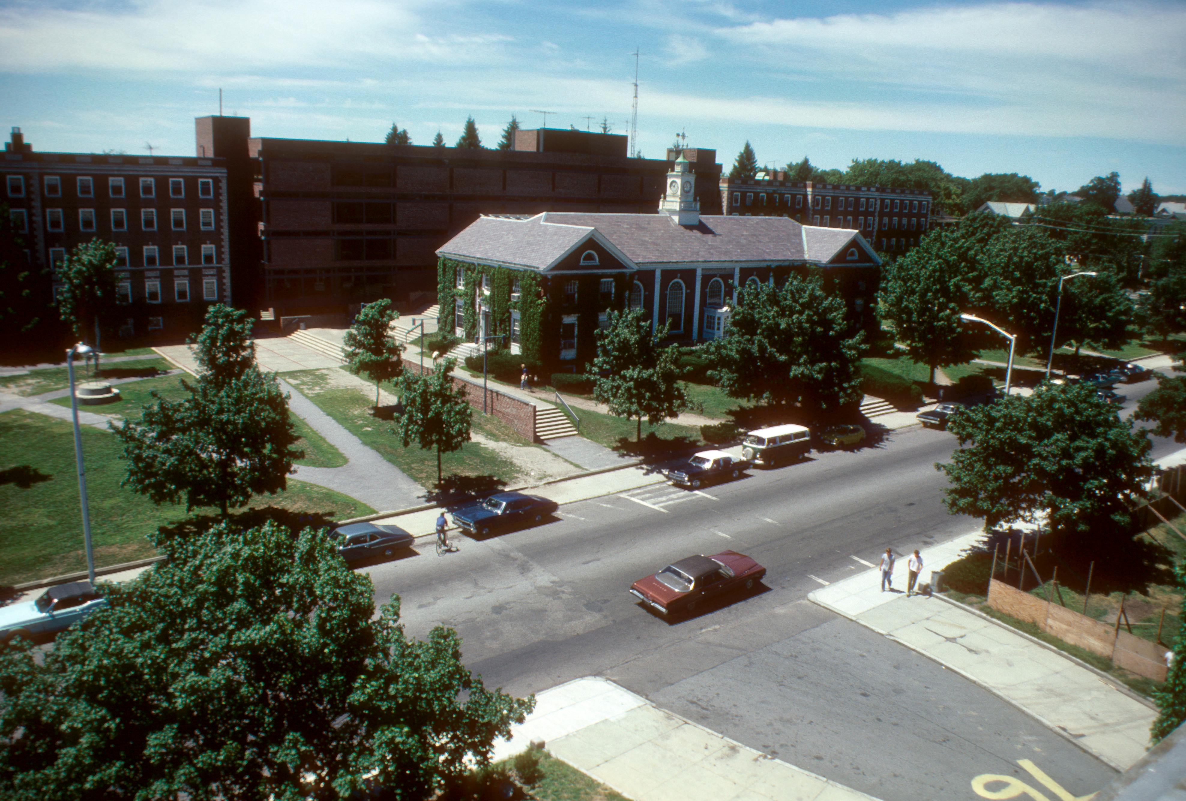 Aerial photo of a college campus in Lowell, showing classic architecture and tree-lined streets.