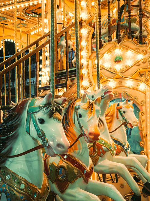 Free A vibrant carousel ride glowing at night, capturing nostalgic fairground magic in Brazil. Stock Photo