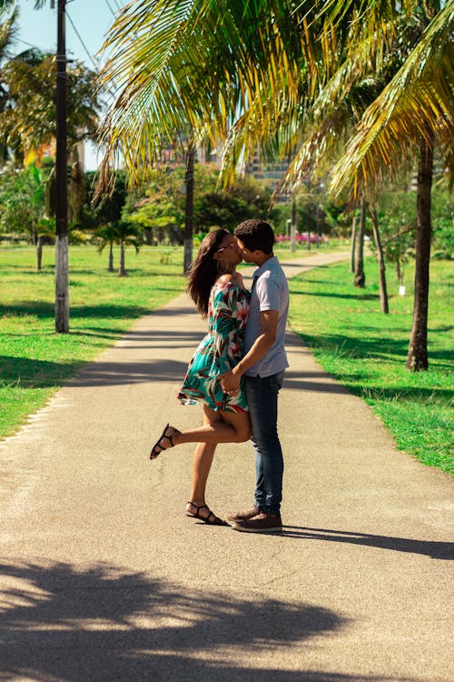 A Couple Kissing In The Park