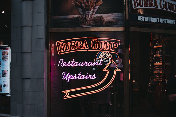 Illuminated Neon Sign Outside A Bar