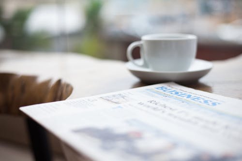 Selective Focus Photography of Business Newspaper