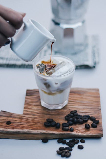 Pour-over coffee dripping onto ice for Japanese iced coffee at home
