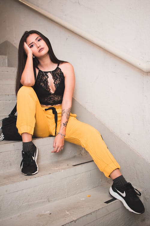 Free Woman Sitting On A Stairway Stock Photo