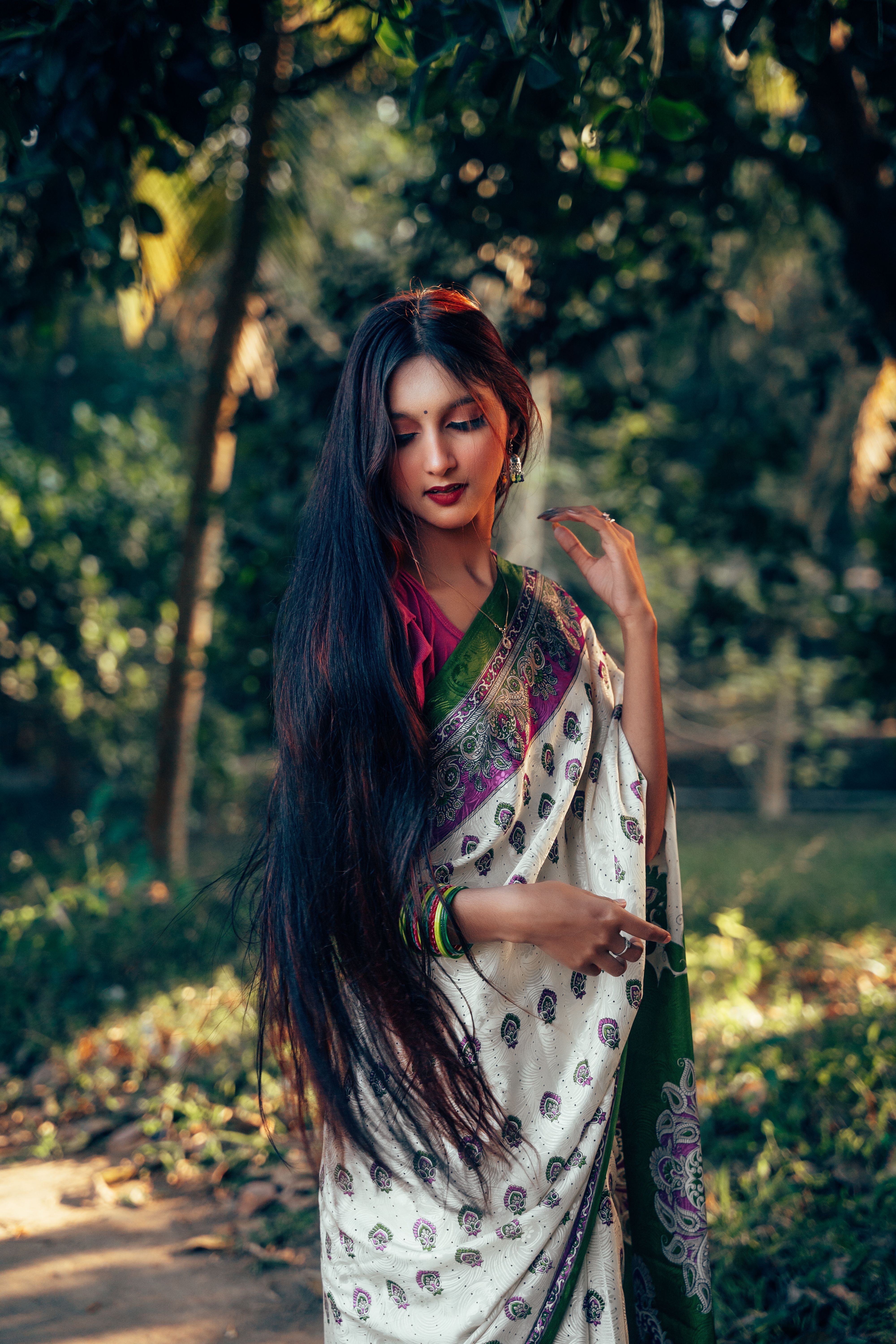 Elegant Woman in Traditional Bengali Saree Outdoors · Free Stock Photo