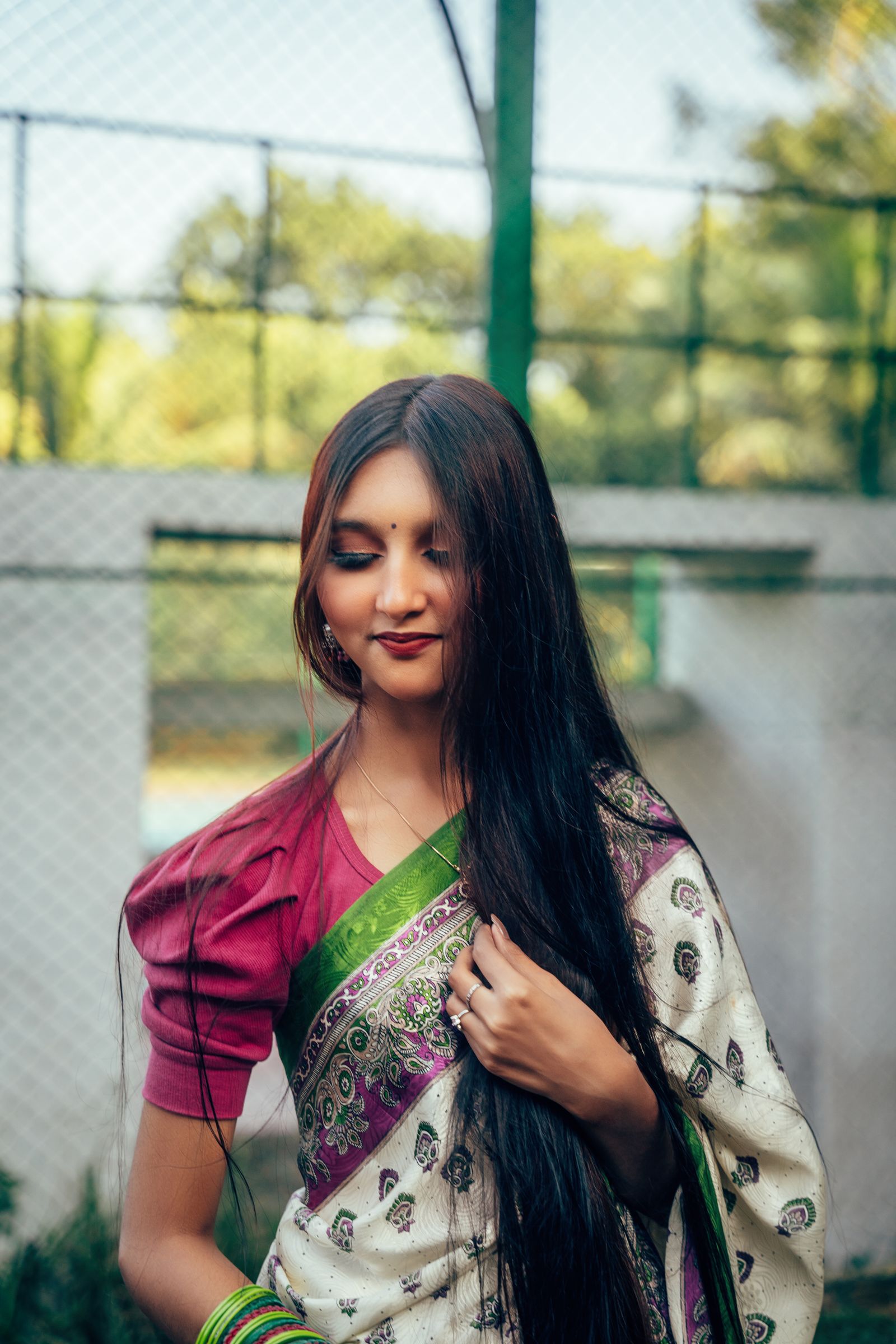 Elegant Woman in Traditional Bengali Saree Outdoors · Free Stock Photo