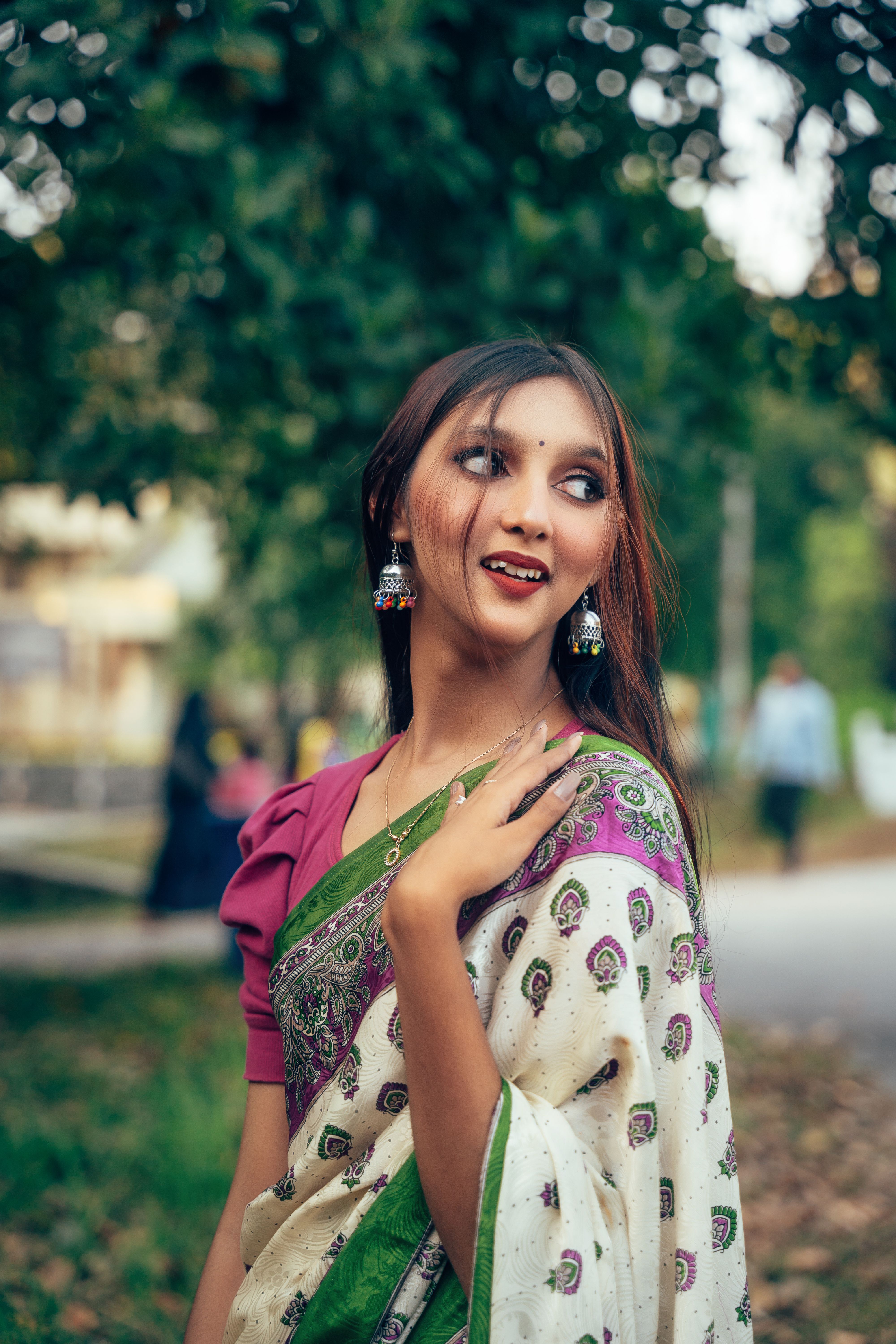 Elegant Woman in Traditional Bengali Saree Outdoors · Free Stock Photo