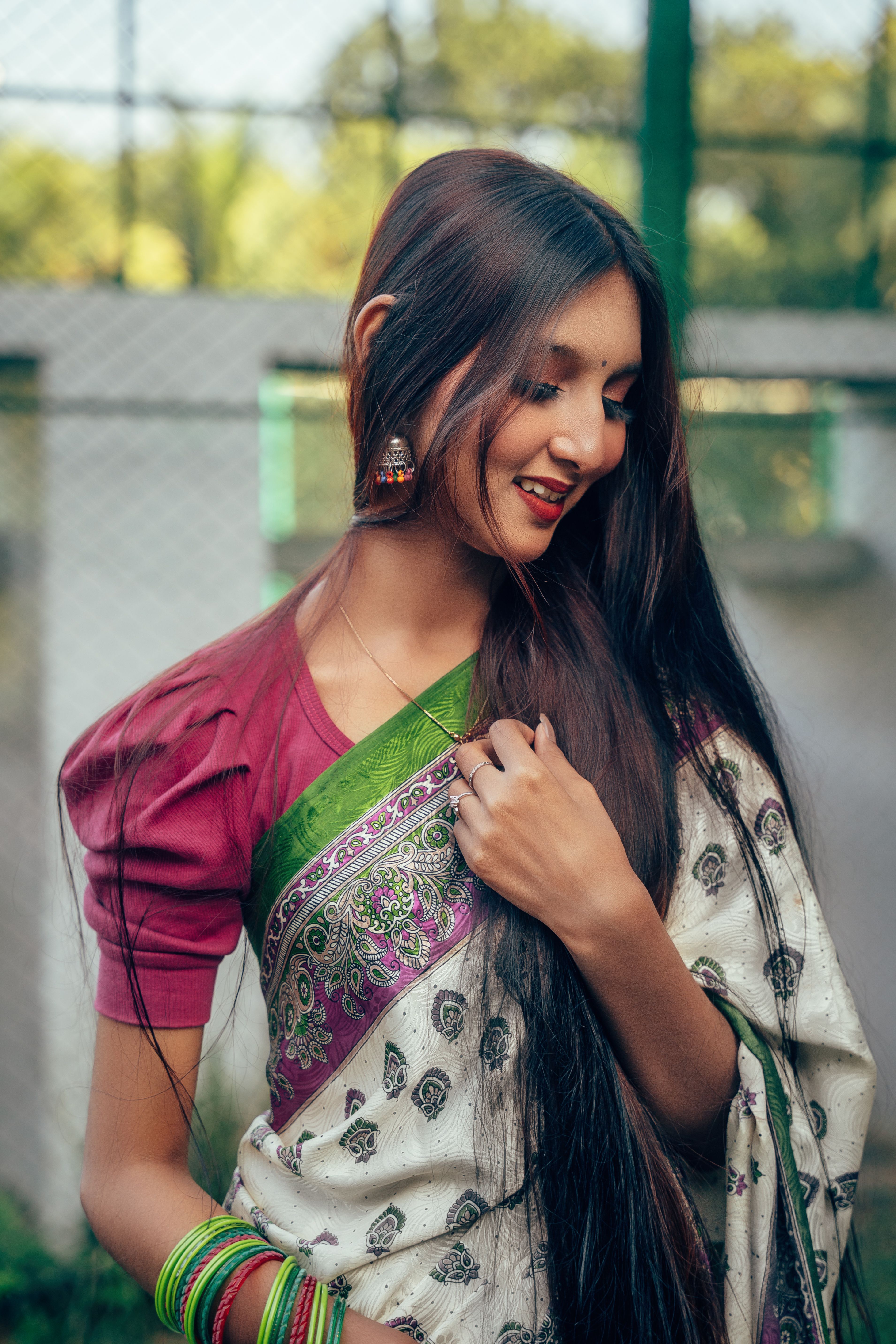 Elegant Woman in Traditional Saree Outdoors · Free Stock Photo