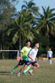 Focused young soccer players in action during an outdoor game.
