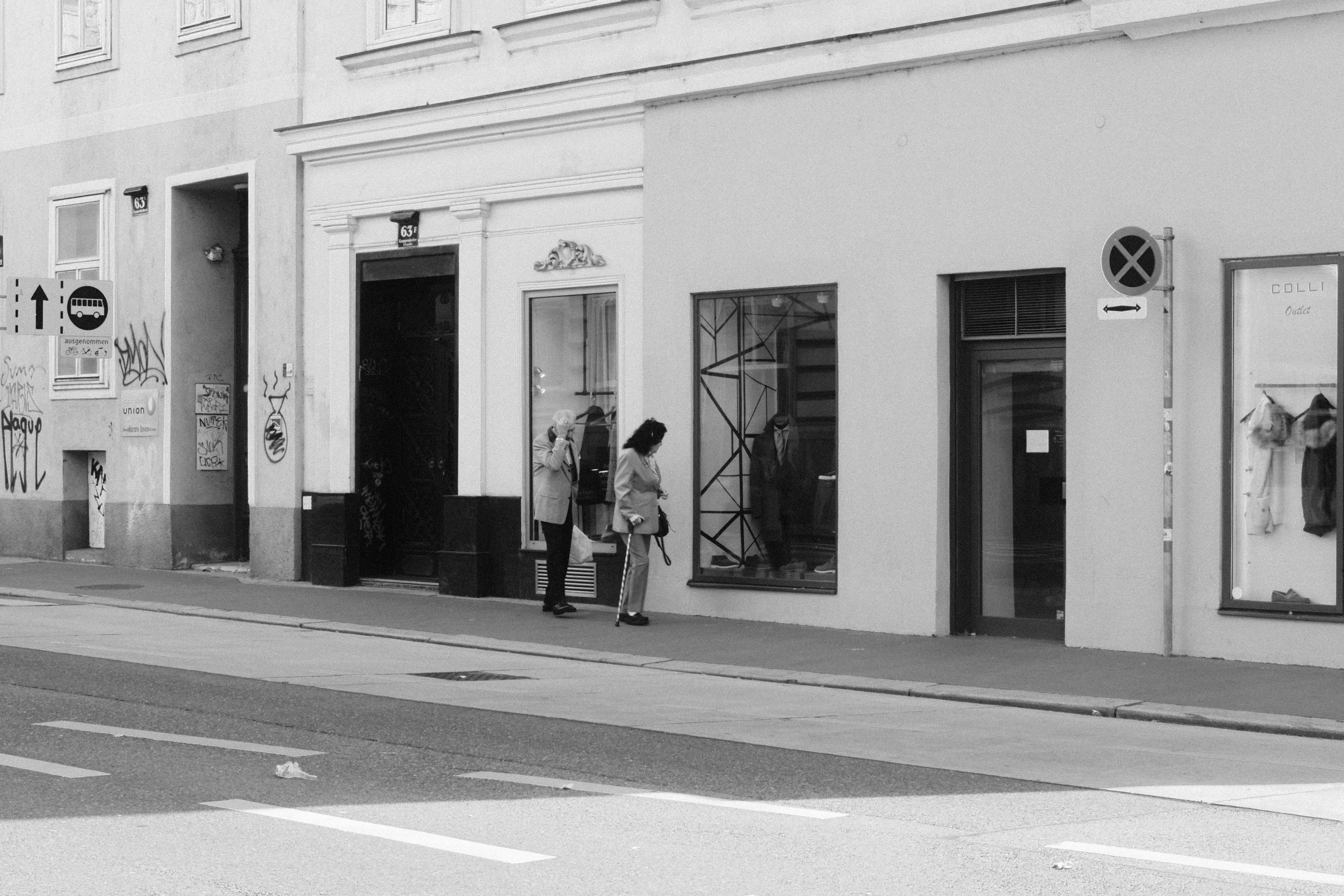 black and white urban street scene with people