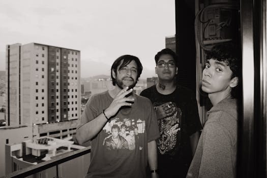 A stylish portrait of three young men standing on a balcony in Monterrey, Mexico.