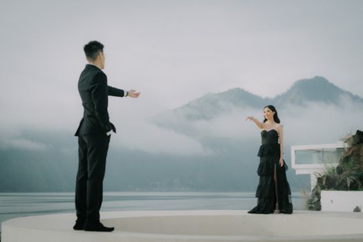 Stylish couple in evening wear during a scenic Bali pre-wedding photo session. - Fotografer Sidoarjo