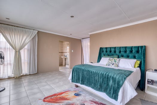 Spacious modern bedroom with elegant design and cozy ambiance. Perfect for real estate or home decor imagery.