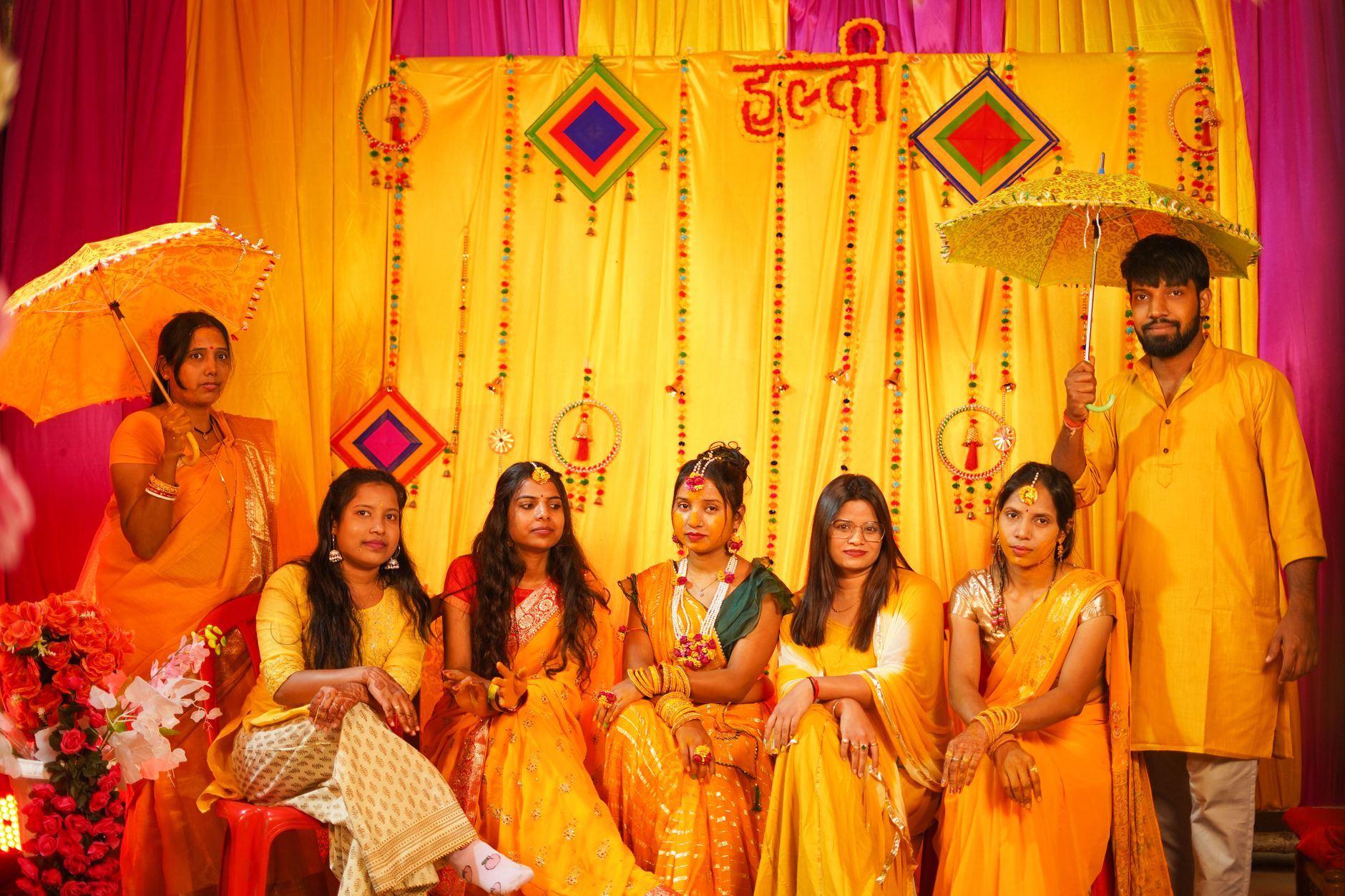 Colorful haldi ceremony in Varanasi, featuring traditional attire and joyful rituals.