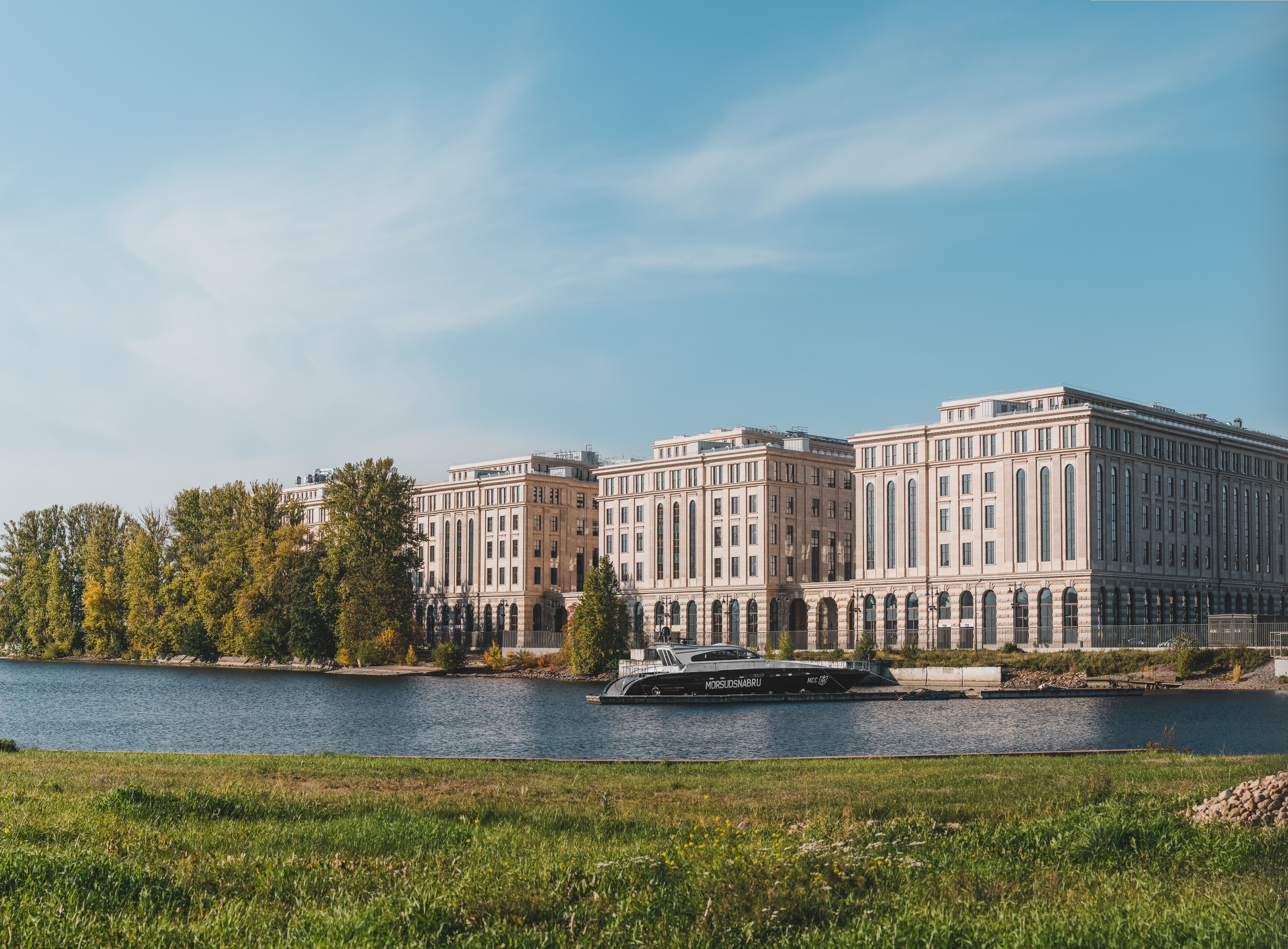 Elegant Riverside Buildings with Scenic View · Free Stock Photo