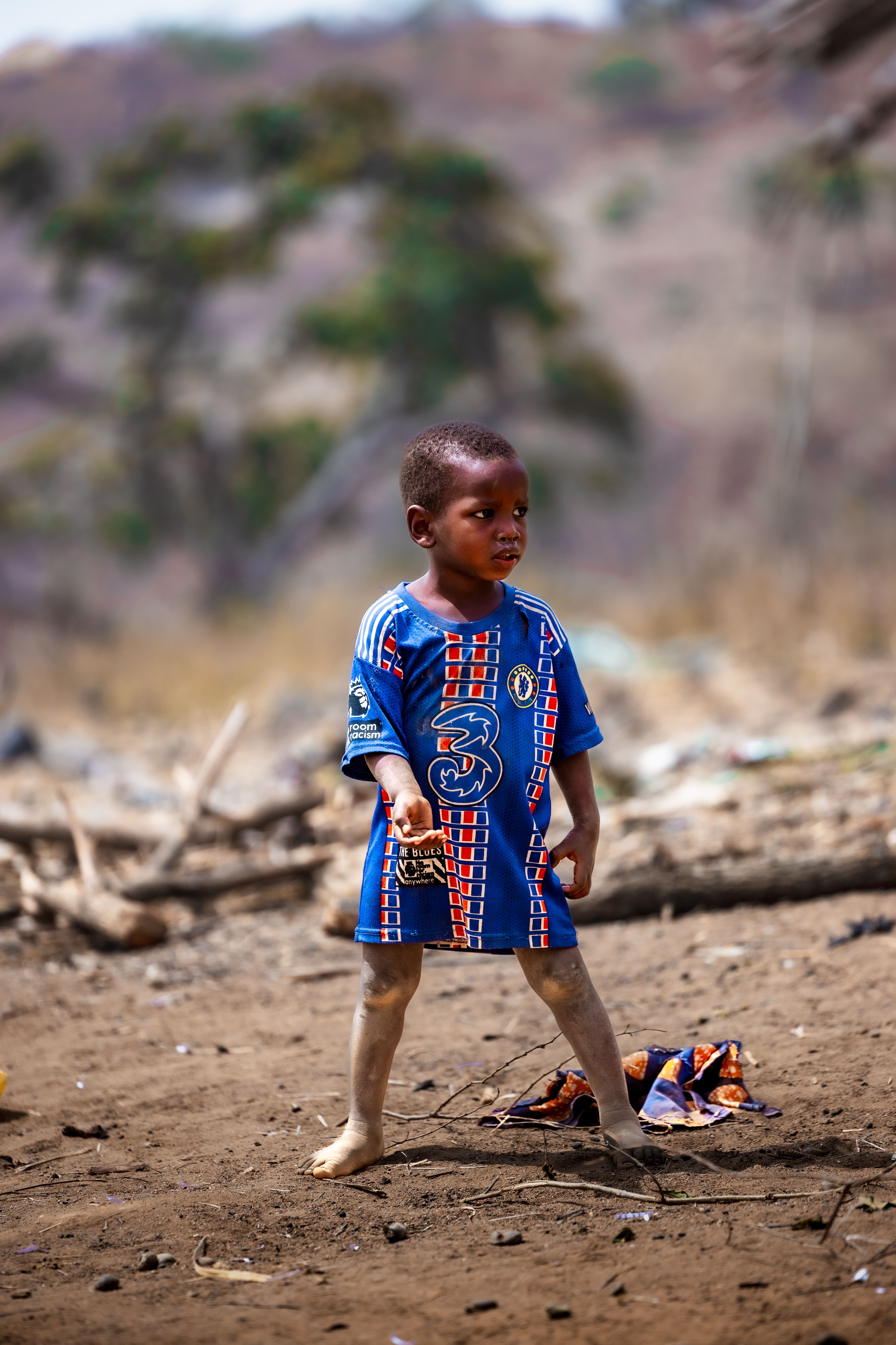 Young African Child in Rural Abuja Setting · Free Stock Photo