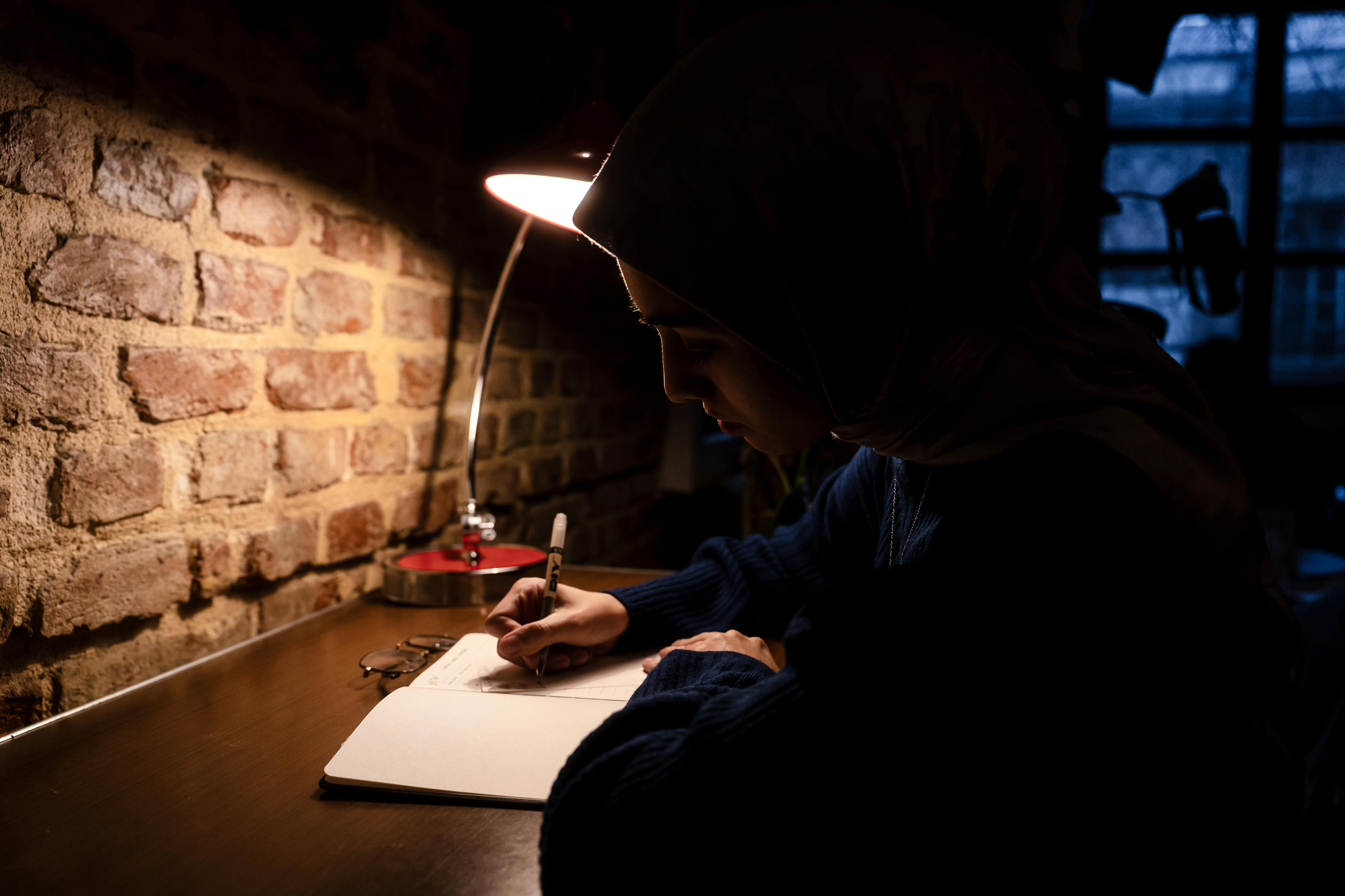 journal and lamp on desk cozy home lifestyle photo 2