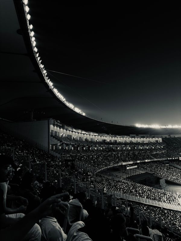 Full stands during a night game — photo by Tanmay Tiwari on Pexels