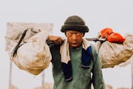 Indonesian Miner Carrying Sulfur at Kawah Ijen