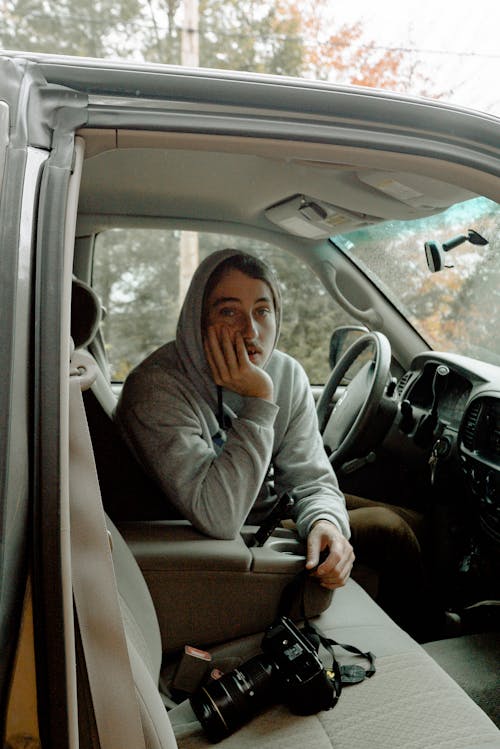 Man Sitting on Driver's Seat