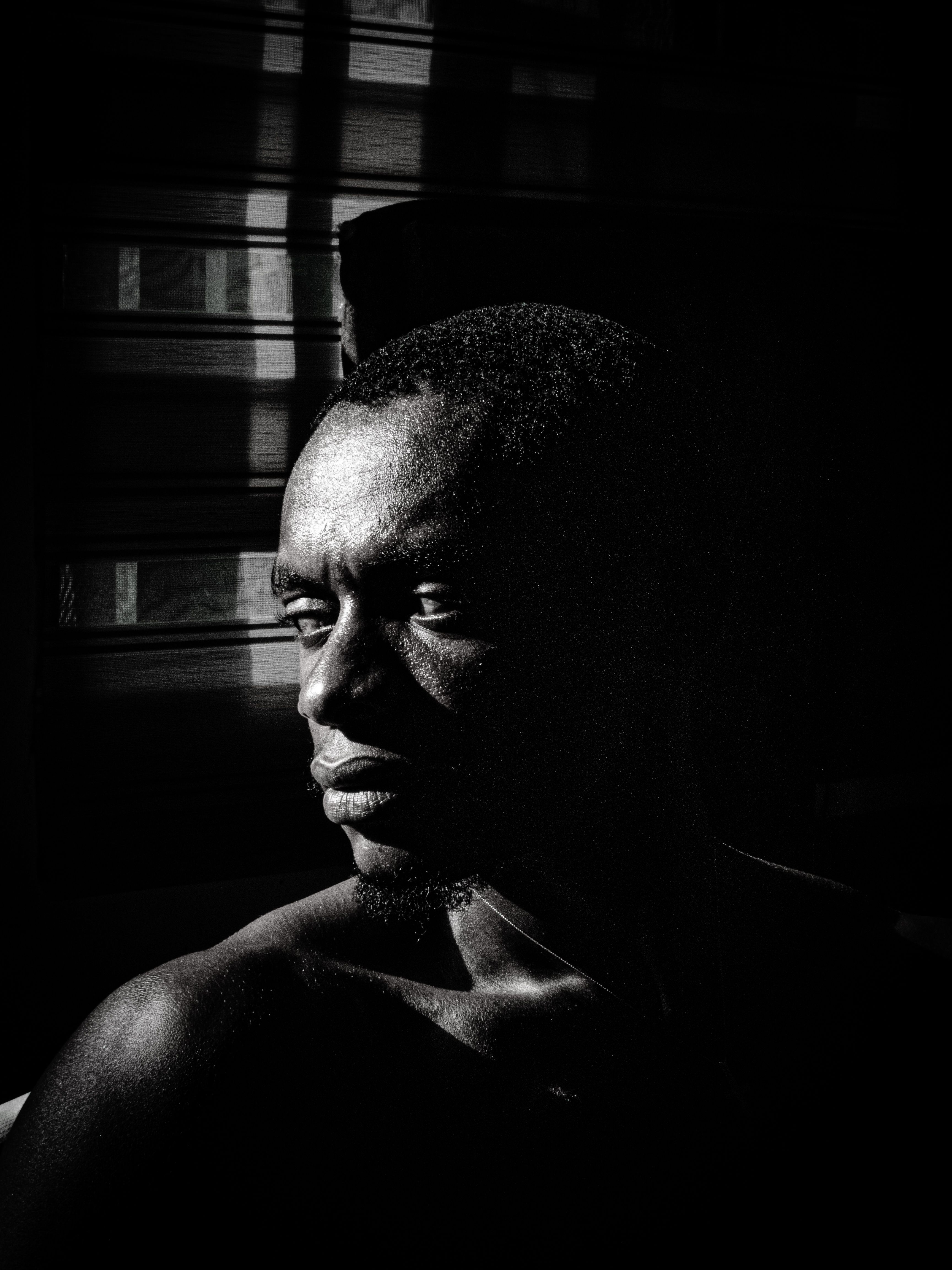 Black and white portrait that shows nuanced skin texture, gentle transitions, and emotional depth.