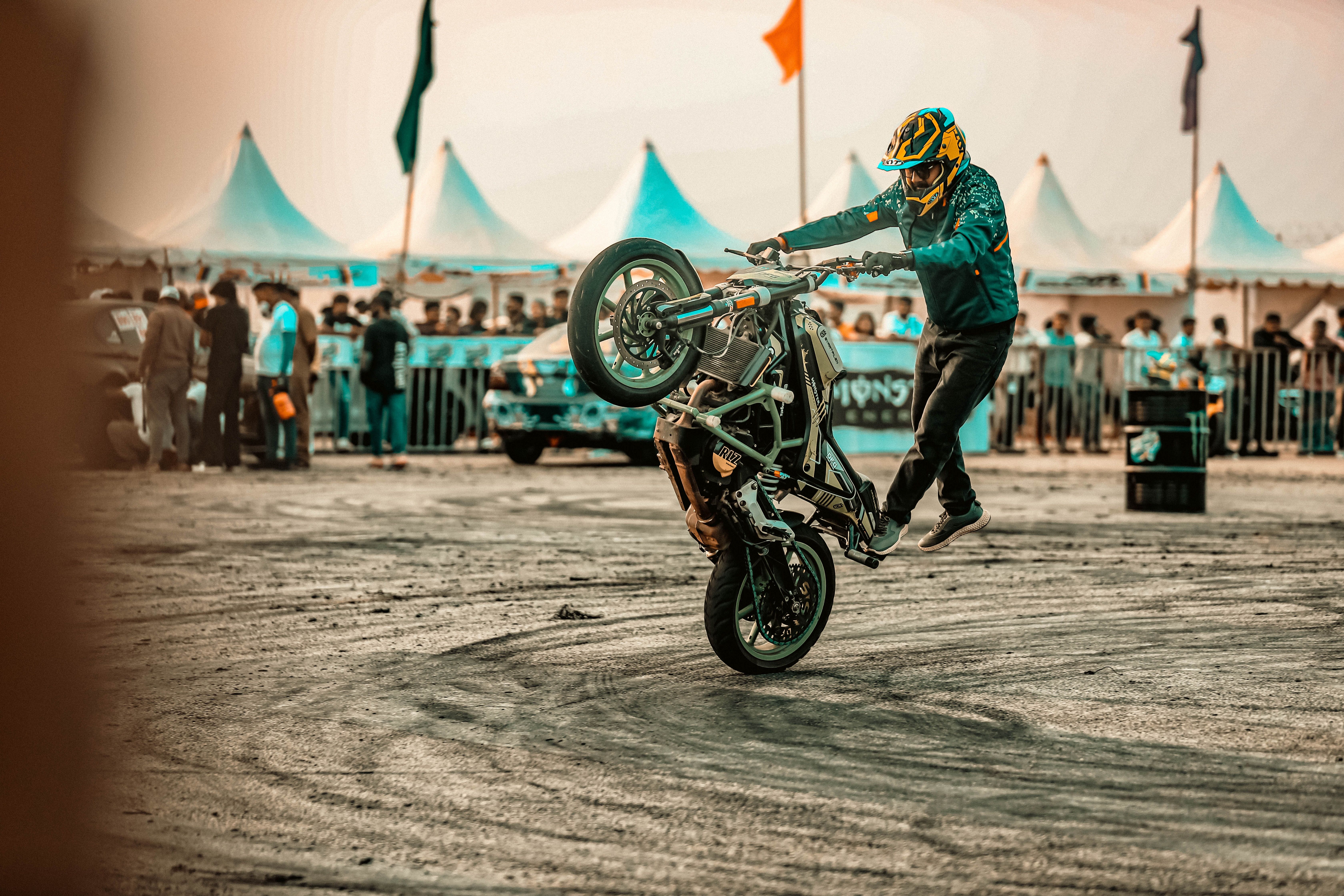 Exciting Motorcycle Stunt Performance at Outdoor Event · Free Stock Photo