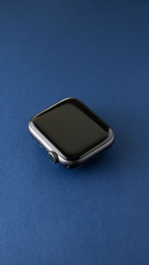 Silver smartwatch on a blue background