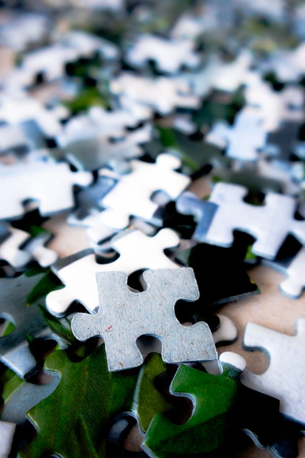 Close-up of colorful puzzle pieces fitting together