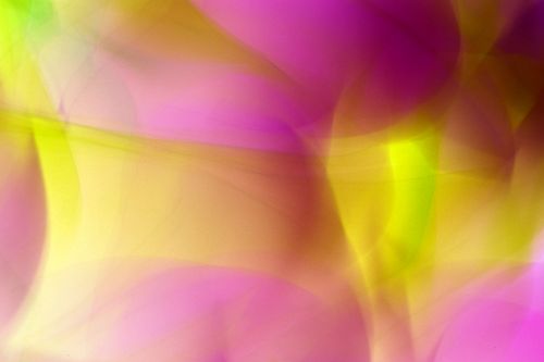 Free Vibrant abstract blur of pink and yellow light waves creating an artistic background. Stock Photo
