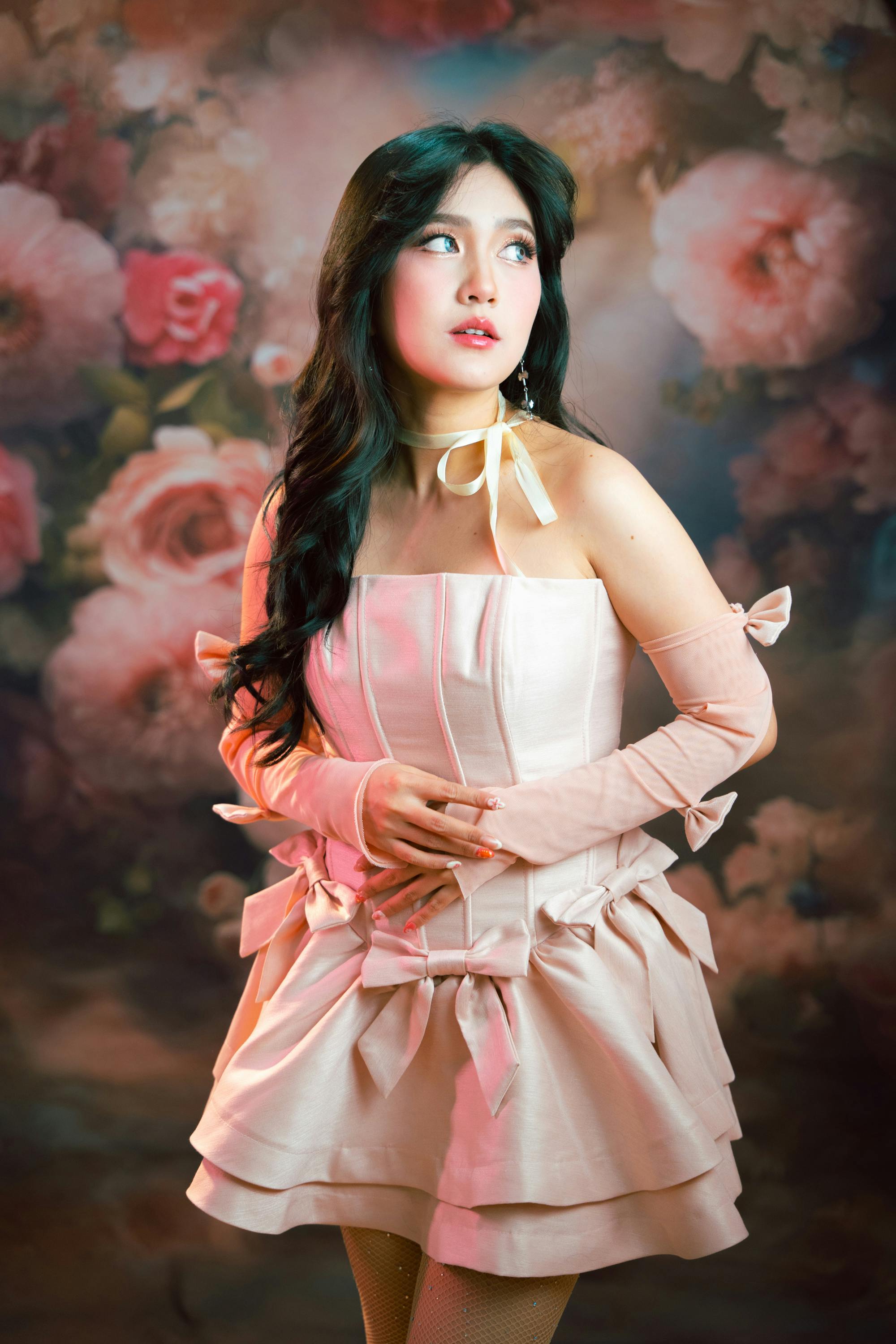 elegant woman in floral setting with romantic dress