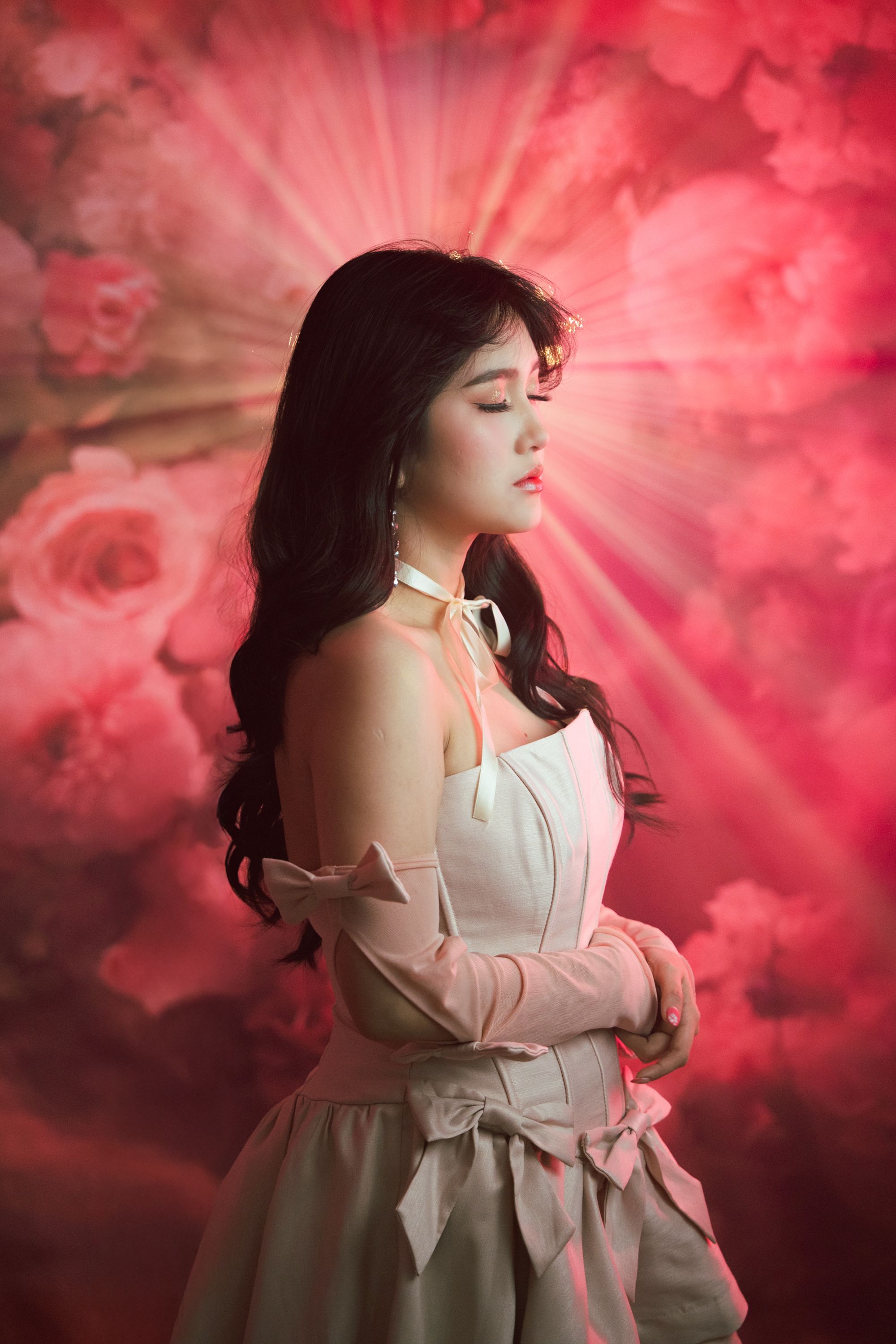 Elegant Woman in Pink Floral Background Portrait · Free Stock Photo