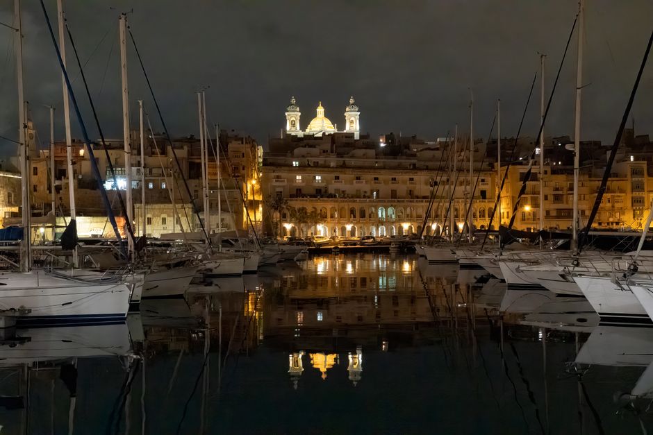 Ultimate Private Day Sailing Boat Charter Review: An Unforgettable Day on Malta's Waters Review 2026 - Stunning night view of Senglea waterfront with yachts and illuminated church towers in Malta.
