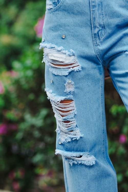 Close-up of Stylish Ripped Denim Jeans · Free Stock Photo