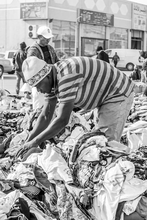 Man in Striped Shirt In Grayscale Photography