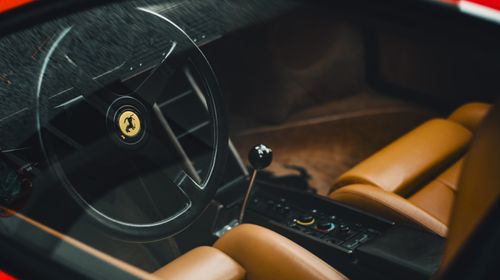 Free Closeup view of a Ferrari interior showcasing leather seats and manual controls. Stock Photo