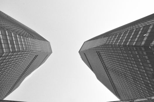 Black and white view of two modern skyscrapers in Shanghai.