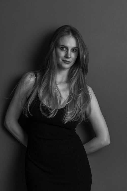 Free Stylish black and white executive headshot with elegant pose, professional and poised. Stock Photo