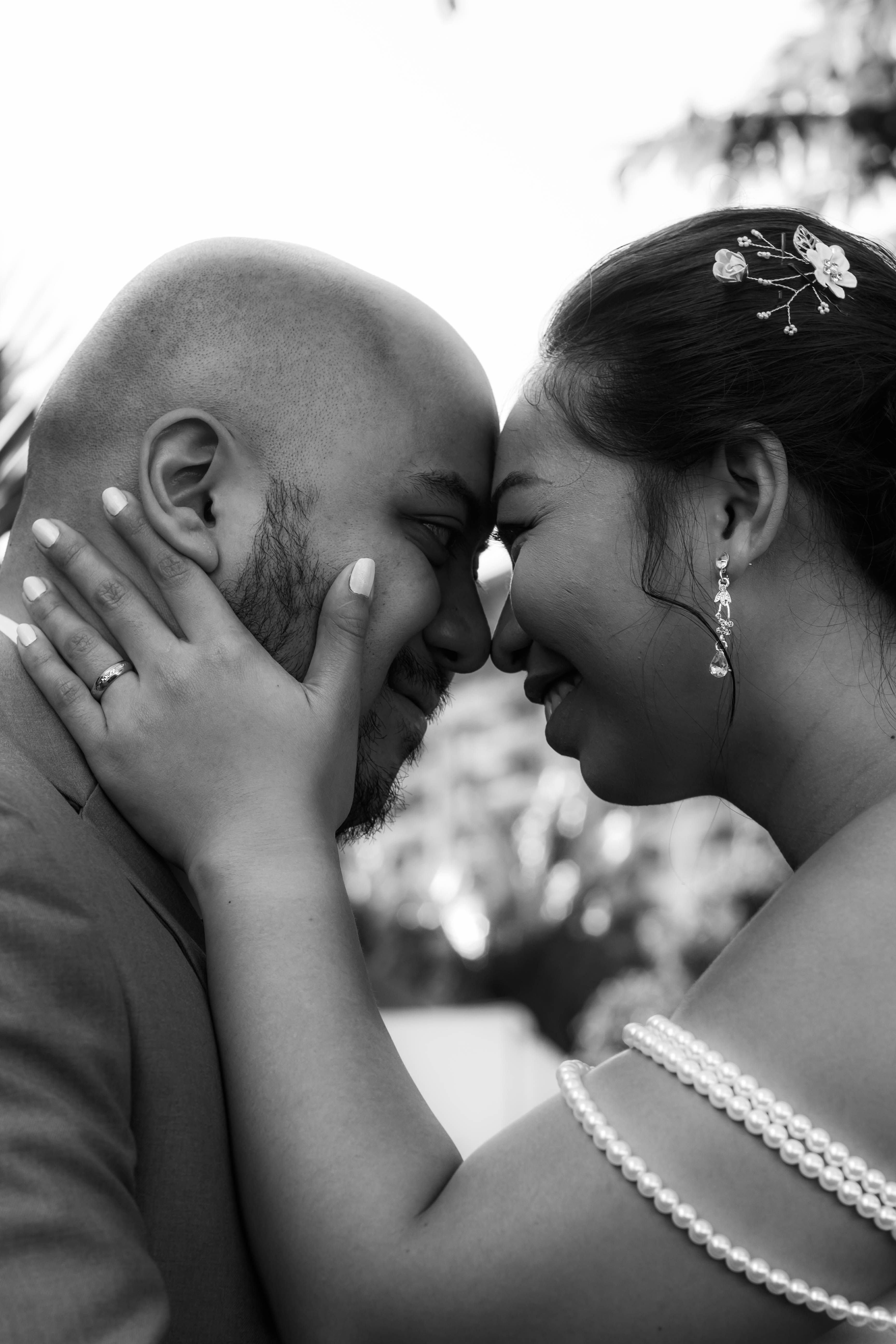 Tender and intimate moment between a couple, captured during their wedding celebration.