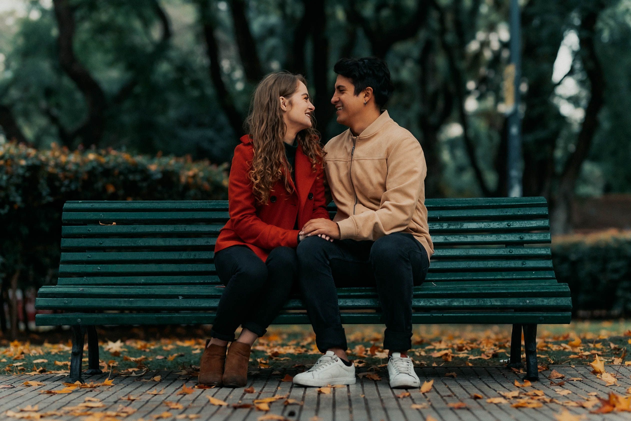 Romantic Couple Sitting on Park Bench in Autumn · Free Stock Photo