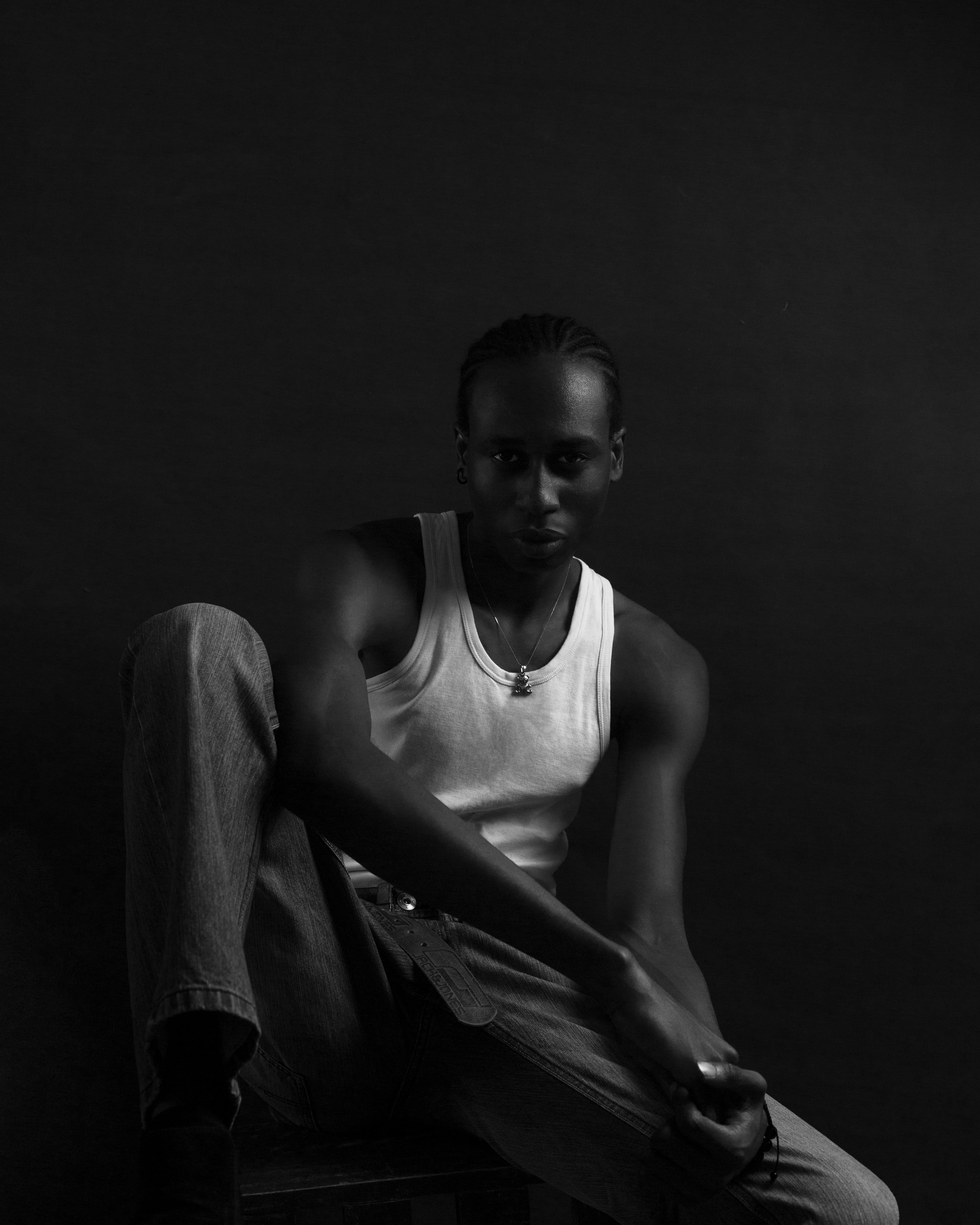 Stylish black and white portrait showcasing a male model from Ibadan, Nigeria.