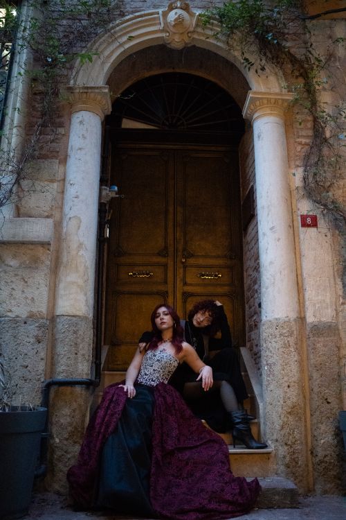 Free Two women in gothic outfits pose on vintage architectural steps. Stock Photo